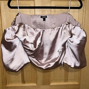 Off the shoulder satin puff sleeve top with stretchy back.